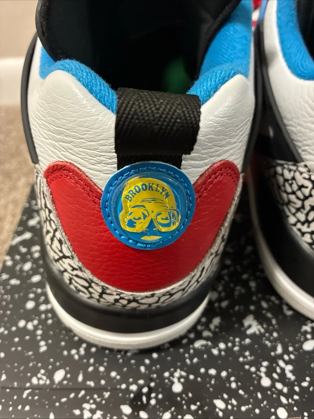 Jordan Men's White Athletic Shoes with Black, Red & Blue Accents